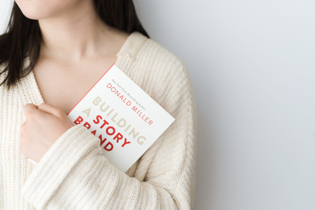 photo-of-woman-holding-brand-storytelling-book